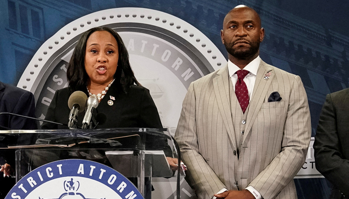 Fulton County District Attorney Fani Willis speaks at a press conference next to prosecutor Nathan Wade after a Grand Jury brought back indictments against former president Donald Trump and his allies in Atlanta, Georgia on August 14, 2023. — Reuters