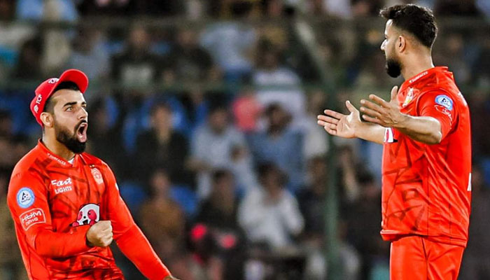 Islamabad United Captain Shadab Khan and Imad Wasim celebrating after a wicket against Multan Sultans in the final of PSL 9 on March 18, 2024.—X@PSL