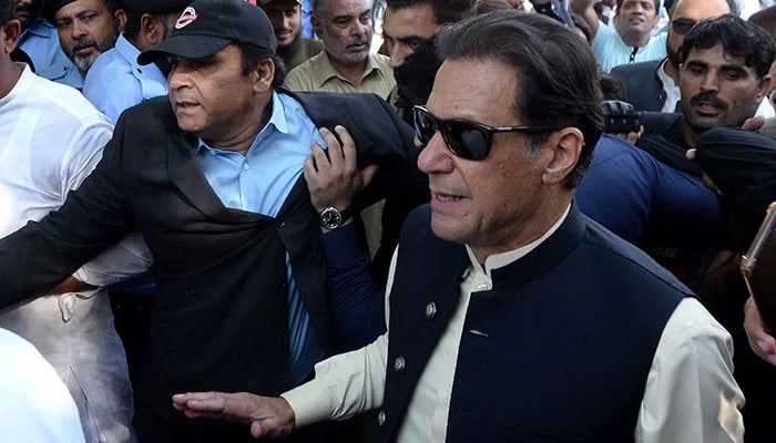 PTI Founder Imran Khan arrives for a hearing at a court. — AFP/File