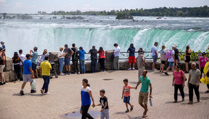 Tourists take photos in front of Niagara Falls in Niagara Falls, Ontario, Canada June 28, 2022. Authorities declare a state of emergency in Niagara Falls amid a total solar eclipse on April 8, 2024. — Reuters
