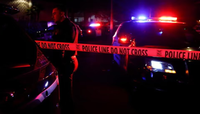 A police officer stands near the Police vehicles as authorities cordoned off the area with police tape in the US. At least one person died in the Nashville, Tennessee shooting. — Reuters/File