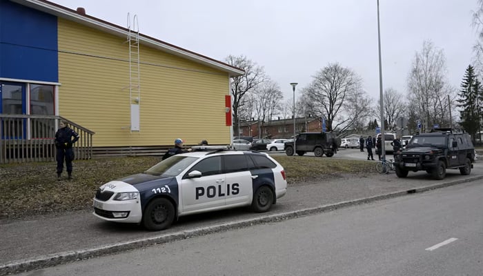 Police officers and police vehicles operate at the Viertola Comprehensive School in Vantaa, Finland on April 2, 2024. Shooting in Finland school kills 12-year-old child, injures two others. — Reuters