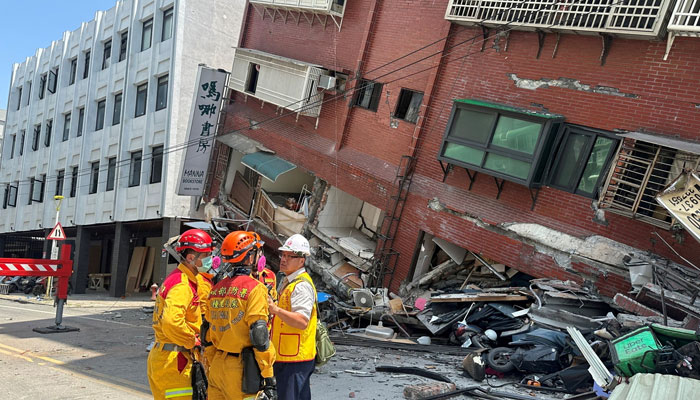 Firefighters work at the site where a building collapsed following the earthquake, in Hualien, Taiwan, in this handout provided by Taiwans National Fire Agency on April 3, 2024. —Reuters