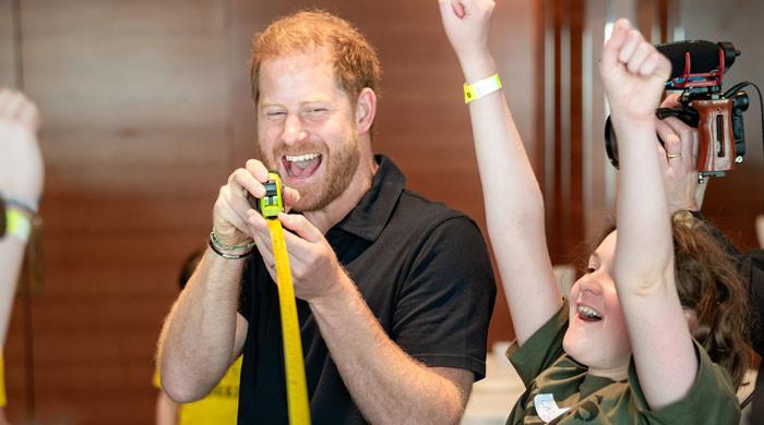 Prince Harry seems ‘more like a child himself’ around kids during charity visit