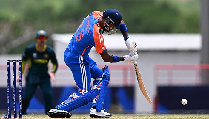 Indias Hardik Pandya hits a shot during the ICC mens Twenty20 World Cup 2024 Super Eight cricket match between Australia and India at Daren Sammy National Cricket Stadium in Gros Islet, Saint Lucia on June 24, 2024. — AFP