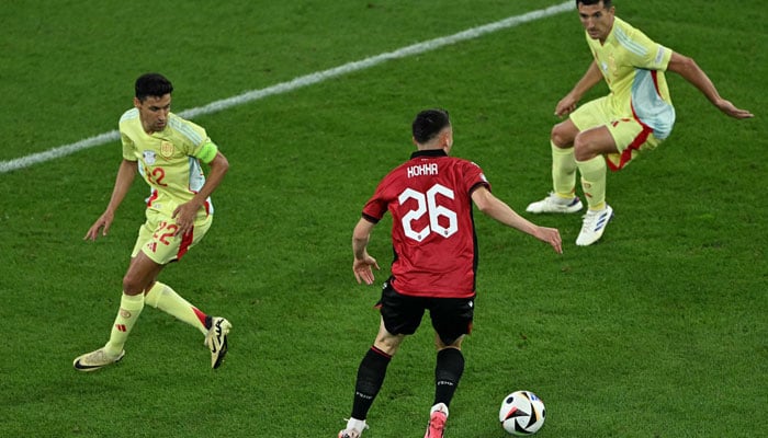 Spains forward #22 Jesus Navas and Spains defender #05 Daniel Vivian mark Albania´s forward #26 Arber Hoxha during the UEFA Euro 2024 Group B football match between Albania and Spain at the Duesseldorf Arena in Duesseldorf on June 24, 2024.  — AFP