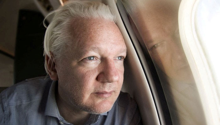 WikiLeaks founder Julian Assange looks out a plane window as he approaches Bangkok airport for layover on June 25, 2024. — Reuters via X/@wikileaks