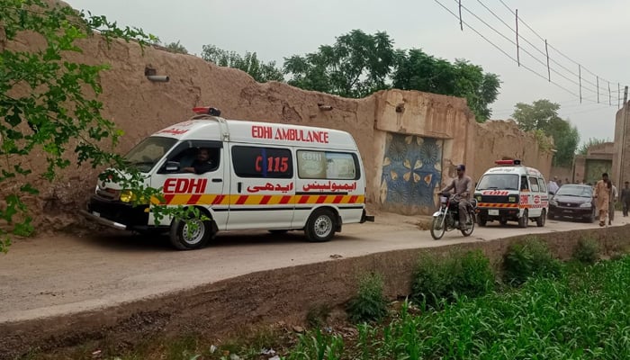Ambulances gather at crime scene where nine of a family killed in gun attack in Peshawars Badaber village on June 25, 2024. — Reporter