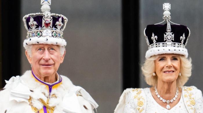 Queen Camilla in awe of King Charles portrait by school students