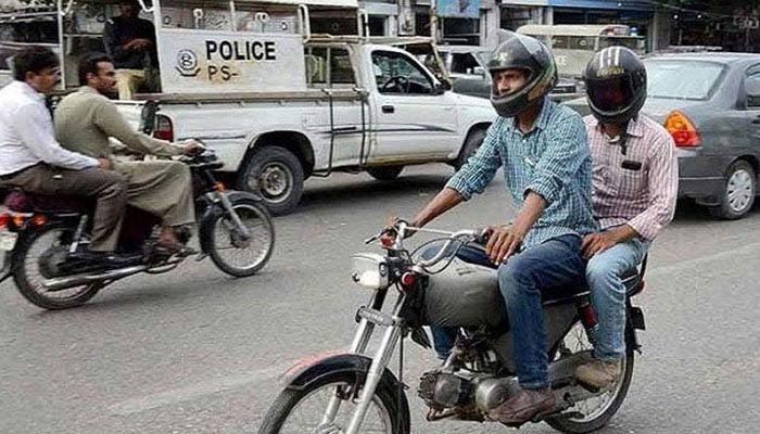Men seen pillion riding on bikes on the streets. — Geo News/File