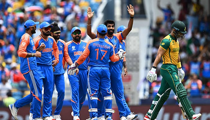 South Africas Reeza Hendricks (R) leaves after getting cleaned bowled by India´s Jasprit Bumrah (2nd R) during the ICC men´s Twenty20 World Cup 2024 final cricket match between India and South Africa at Kensington Oval in Bridgetown, Barbados, on June 29, 2024. — AFP