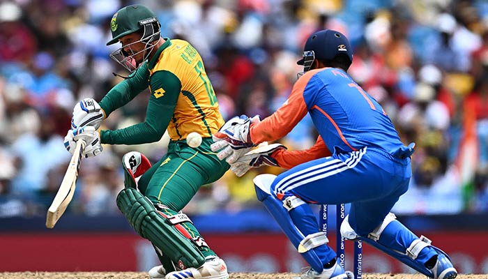 South Africas Reeza Hendricks (R) leaves after getting cleaned bowled by India´s Jasprit Bumrah (2nd R) during the ICC men´s Twenty20 World Cup 2024 final cricket match between India and South Africa at Kensington Oval in Bridgetown, Barbados, on June 29, 2024. — AFP