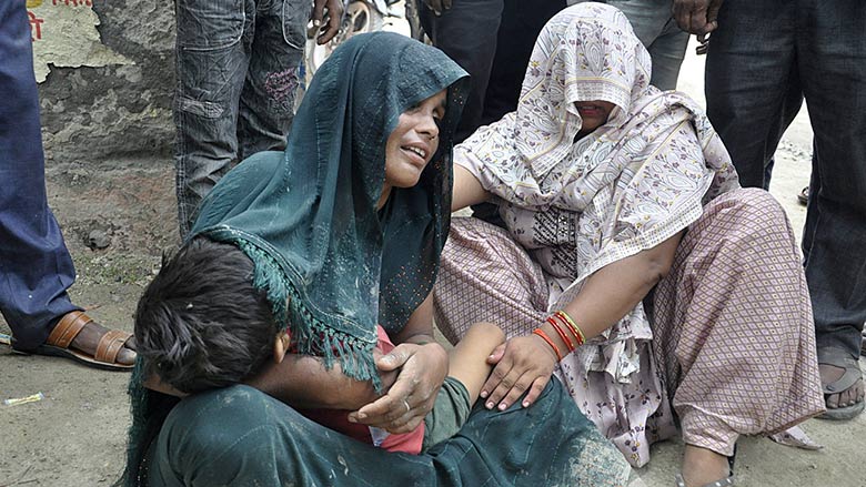 A woman is consoled as she mourns after her son died in a stampede outside a hospital in Hathras district in the northern state of Uttar Pradesh, India, July 2, 2024. — Reuters