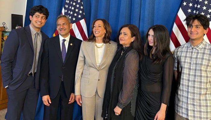 U.S. Vice President Kamala Harris poses for a photo with Pakistani-American Democrat Dr. Asif Mahmood and his family at a political event in Bradbury, California, on June 26, 2024. — Dr. Asif Mahmood