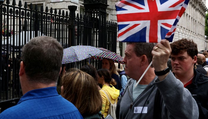 Tourists pass by the entrance to Downing Street, ahead of the UK general elections on July 4, in London, Britain, July 3, 2024. — REUTERS