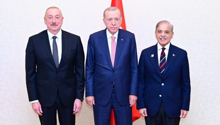 (Right to left): Prime Minister Muhammad Shehbaz Sharif in a group photo with the President of Turkiye Recep Tayyib Erdogan and President of Azerbaijan Ilham Aliyev on the occasion of an inaugural session of Pakistan-Turkiye-Azerbaijan Trilateral Summit on the sidelines of Shanghai Cooperation Organisation Summit. — APP