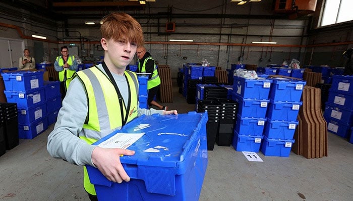 Workers prepare to deliver election ballot boxes in Edinburgh, Scotland, Britain July 3, 2024. — Reuters