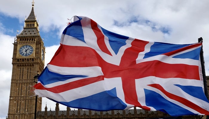 A Union Jack flag flutters in the wind near Big Ben and Parliament in Parliament Square in London, Britain, March 29, 2024.— Reuters