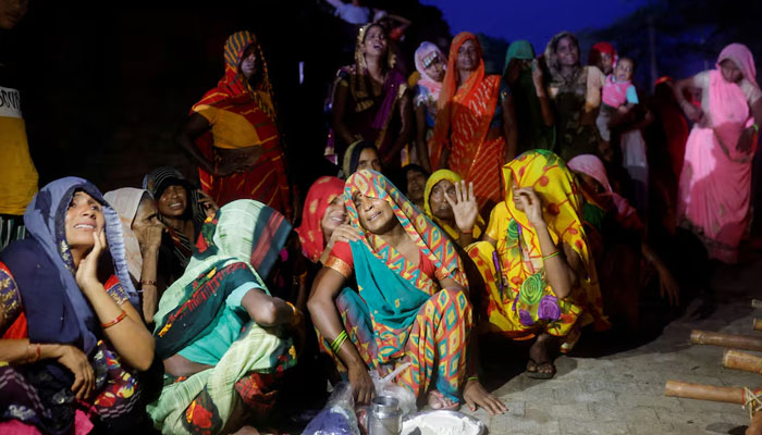 Relatives mourn the death of stampede victims Kamlesh Jatav, 22, and her seven-month-old daughter in Daunkeli village, Hathras district, in the northern state of Uttar Pradesh, India, July 3, 2024. — Reuters