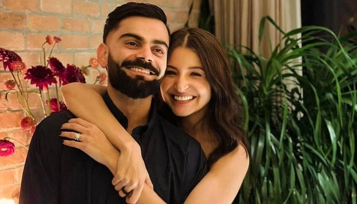 Indian cricketer Virat Kohli poses with his wife and actor Anushka Sharma. — X/@imVkohli