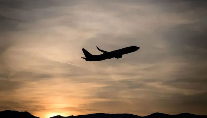 A representational images of the silhouette of an aeroplane during flight. — AFP/File