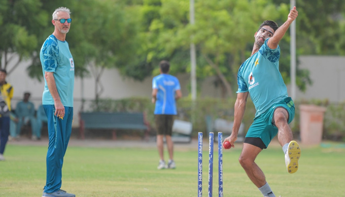 Pakistan red-ball coach Jason Gillespie watches over as cricketers practice. — reporter