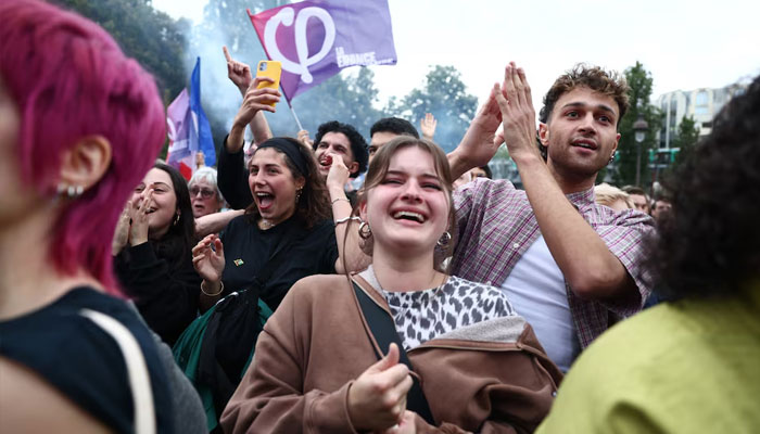 Supporters of French far-left opposition party La France Insoumise (France Unbowed - LFI) react after partial results in the second round of the early French parliamentary elections at Place Stalingrad in Paris, France, July 7, 2024. — Reuters