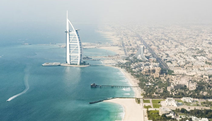 An aerial view of the Burj Al Arab skyscraper and its beach in Dubai, UAE can be seen in this undated image. — Unsplash