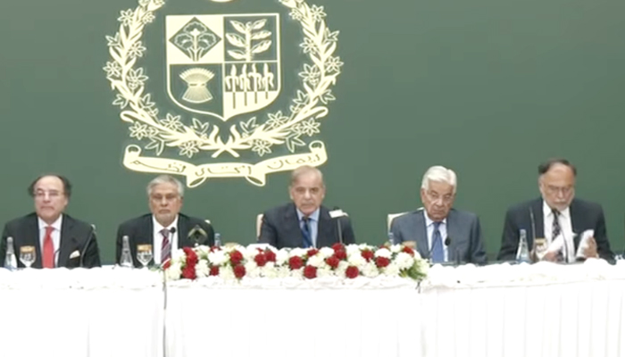 Prime Minister Shehbaz Sharif (centre) is addressing the media on July 9, 2024. — Screengrab/YouTube/GeoNews