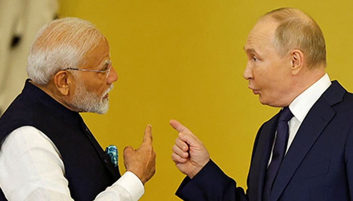 Russias President Vladimir Putin talks to Indias Prime Minister Narendra Modi before awarding him the Order of St. Andrew the Apostle the First-Called at the Kremlin in Moscow, Russia July 9, 2024