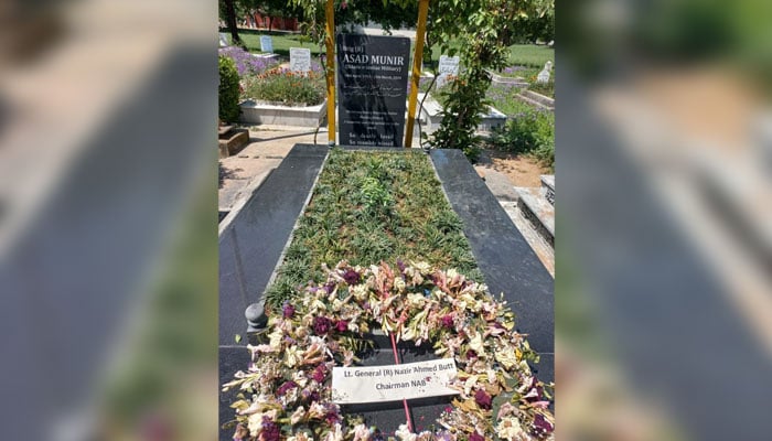 A floral wreath can be seen at the grave of Brig (retd) Asad Munir. — Photo by author