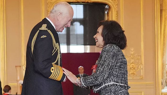 Shirley Bassey reacts as she breaks royal protocol