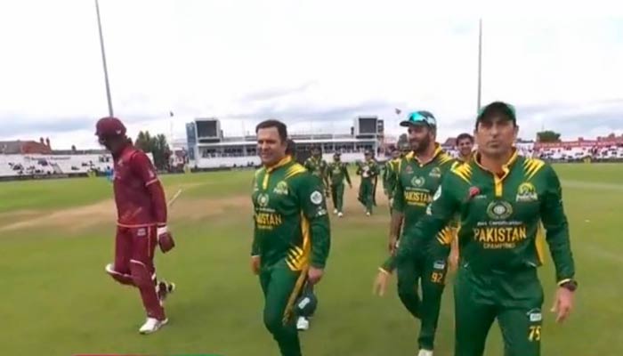 Pakistani and West Indian senior cricketers walk back to pavillion after first semi-final of World Championship of Legends 2024 on July 12, 2024. — X