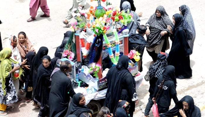 Mourners attending the Ashura procession at Qadmgah Mola Ali on 10th Muharram in Hyderabad on July 30, 2023. —INP