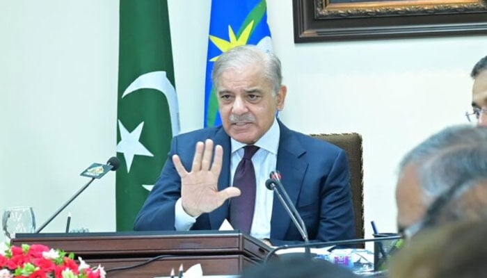 Prime Minister Muhammad Shehbaz Sharif addressing officers during his visit to headquarters of the Federal Board of Revenue. — APP