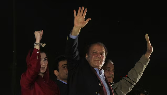 PML-N President Nawaz Sharif gestures to supporters upon his arrival from a self-imposed exile in London, ahead of the 2024 Pakistani general election, in Lahore, Pakistan, October 21, 2023. — Reuters