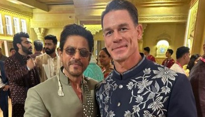 WWE wrestler John Cena pictured with Bollywood star Shah Rukh Khan at Ananat Ambanis wedding in Mumbai in this image released on July 13, 2024. — X/ @JohnCena