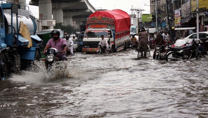 Commuters are facing difficulties in transportation because of accumulating rainwater after heavy downpour of monsoon, at Chauburji Chowk in Lahore, on July 12, 2024. —PPI