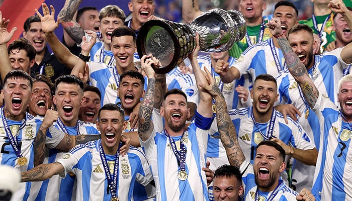 Argentinas Lionel Messi lifts the trophy as he celebrates with teammates after winning Copa America 2024 after defeating Colombia in the final at Hard Rock Stadium, Miami, Florida, US in this image released on July 15, 2024. — Reuters