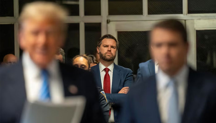 US Senator JD Vance listens to former President Donald Trump address the Pool Press outside the Manhattan Criminal Court room during trial in NYC May 13 2024. — Reuters