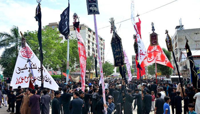 A large numbers of Mourners attending Ashura procession on 9th Muharram ul Haram at Latifabad. — APP