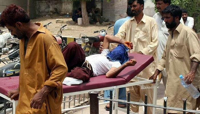 A heat stroke patient is rushed to the emergency ward at a hospital in Karachi. — PPI/File