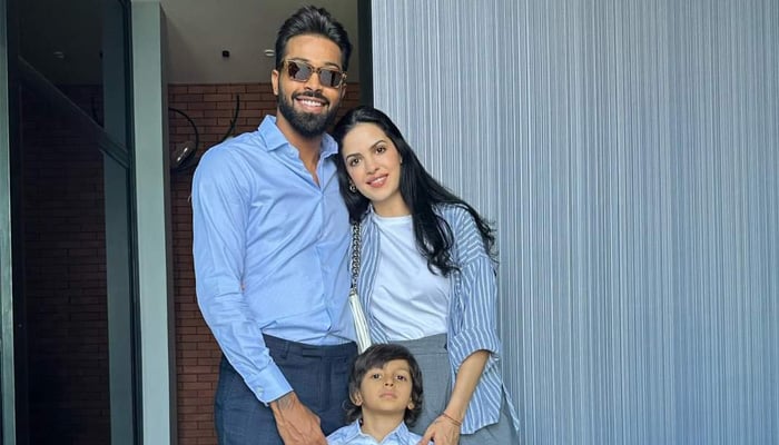 Indian all-rounder Hardik Pandya and wife Natasa pose for a picture with their son. — Instagram/Hardik Pandya