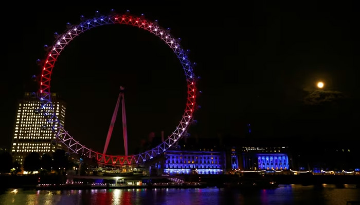 The eye lit up red, white and blue to announce the birth of Prince George, son of William and Kate. — Reuters