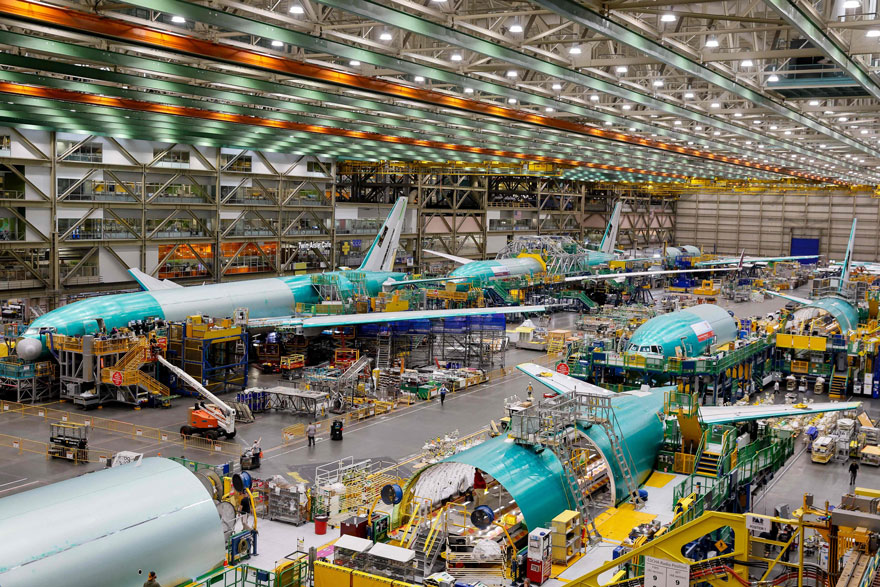 Boeing employees build 777 aircrafts under production at the Everett Production Facility on June 26, 2024 in Everett, Washington. — AFP