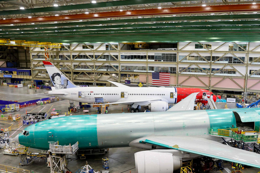 Boeing employees build 777 aircrafts under production at the Everett Production Facility on June 26, 2024 in Everett, Washington. — AFP