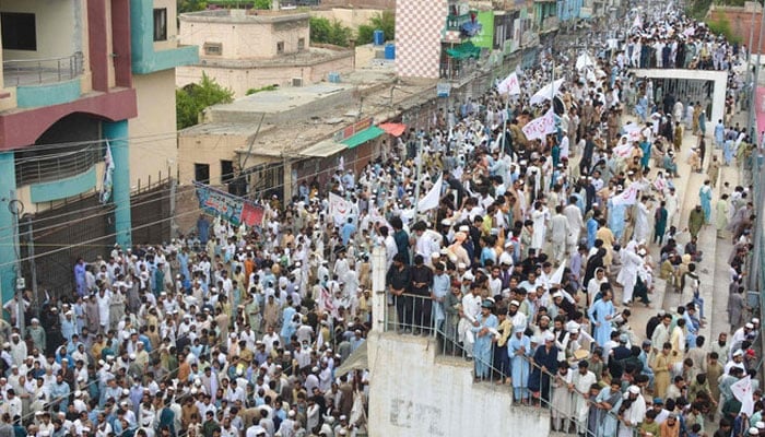 Residents take part in a peace rally to protest after the recent suicide attack by militants on an army enclave in Bannu, on July 19, 2024. — AFP