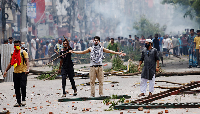 A demonstrator gestures as protesters clash with Border Guard Bangladesh (BGB) and the police outside the state-owned Bangladesh Television as violence erupts across the country after anti-quota protests by students, in Dhaka, Bangladesh, July 19, 2024. — Reuters