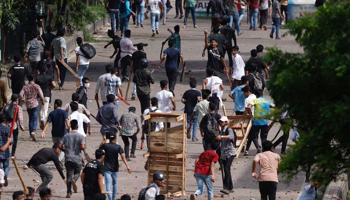 Bangladesh Chhatra League, the student wing of the ruling party Bangladesh Awami League, and anti-quota protesters engage in a clash at the Dhaka College area on July 16, 2024 in Dhaka, Bangladesh.  — Reuters