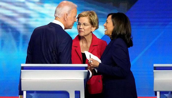 President Joe Biden in conversation with Senator Elizabeth Warren (centre) and Vice President Kamala Harris (right) after the conclusion of the 2020 Democratic US presidential debate on September 12, 2019 in Houston, Texas — Reuters